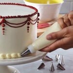 Cake decorator set with piping bag and steel nozzles